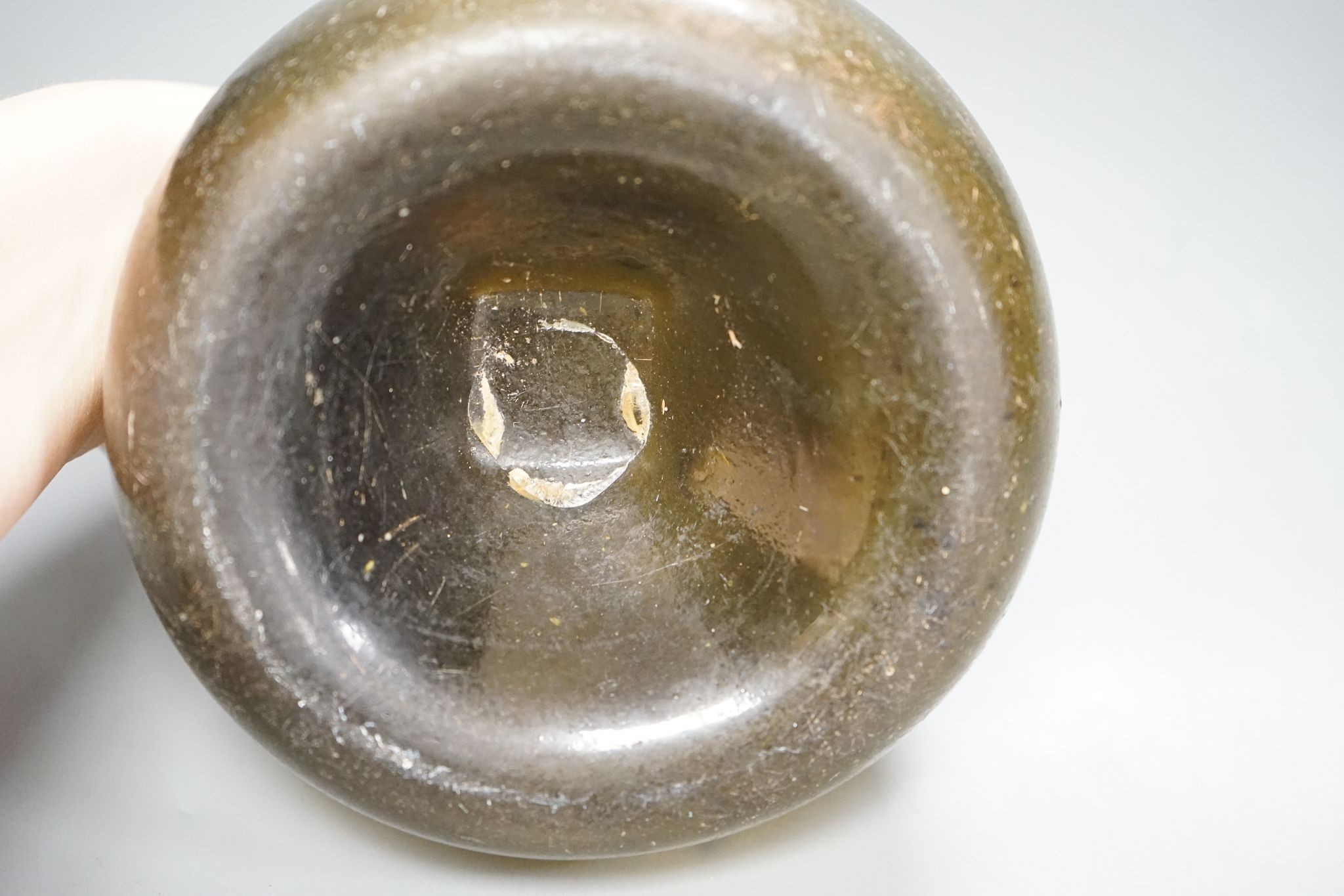 Early 18th century Dutch olive green glass onion shaped bottle, 16cm